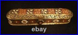 A very nice antique Mughal copper enamelled pen box decorated by cartouches of v