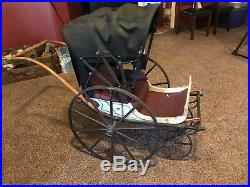 Antique baby carriage. Very nice