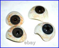 Four very nice antique human glass eyes