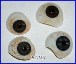 Four very nice antique human glass eyes