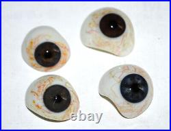 Four very nice antique human glass eyes prosthesis