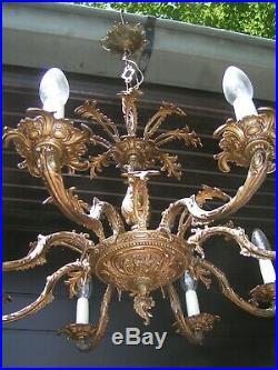 Very nice ornated vintage 8 lt aged brass chandelier. Look @ this 1